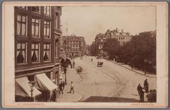 View of Rembrandtplein from Reguliersbreestraat towards Amstelstraat entrance in Amsterdam, historical black and white photo from late 19th century