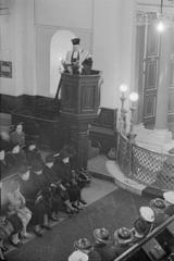 The Great Synagogue in Dukes Place London after 250 years in 1941 with Reverend Barnett Joseph reading a memorial to Myer Cash