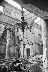 Ruins of Great Synagogue in London after 1941 air raid with broken chandelier hanging amid rubble