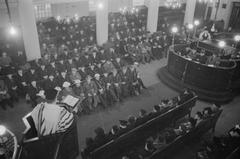 The Great Synagogue, Dukes Place, London in 1941 with East London Jewish community gathered after Passover to remember Myer Cash, a respected synagogue board member killed in an air raid