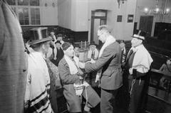 The Great Synagogue in Dukes Place London after 250 years in 1941 with Beadle Phineas Rosenthal and Assistant-Beadle Lazarus Jacobs watching a soldier and airman tying the Law scroll