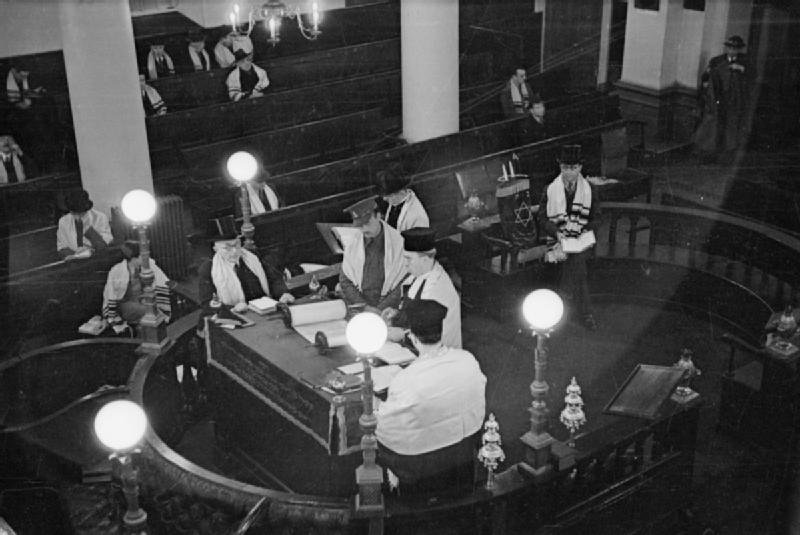 The Great Synagogue in London during 1941, showing a soldier called to the Law with Reverend Hermann Mayerowitsch and wardens Moses Montefiori Godinsky and Samuel Klein
