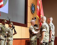 Sergeant Major William T. Thurber presenting MARCENT battle colors to Lt. Gen. Dave Beydler during change of command ceremony at MacDill Air Force Base