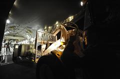 U.S. Air Force Master Sgt. marshals forklift loading generator onto C-17 Globemaster III aircraft for earthquake relief