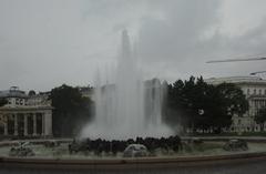 Hochstrahlbrunnen fountain in Stuttgart with water jets and colorful lighting at night