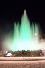 Hochstrahlbrunnen fountain illuminated with green lights at night