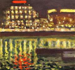 Nighttime view of Paris with illuminated buildings and river