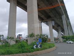 Stonecutters Bridge and Tsing Sha Highway flyover over Container Port Road South at Stonecutters Island in Hong Kong, June 2024