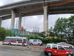 Stonecutters Island Container Port Road South with Stonecutters Bridge and Tsing Sha Highway flyover in Hong Kong in June 2024
