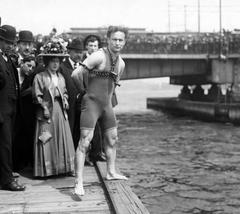 Harry Houdini performing a daring jump from Harvard Bridge in Boston, Massachusetts in 1908