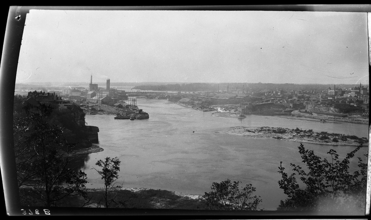 View over Ottawa River towards Hull, Quebec with lumber and paper mill in the background