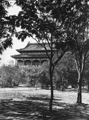 Traditional Chinese arched gateway with ornate roof and red pillars