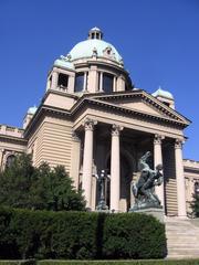 Front view of Belgrade's Parliament or Federal Assembly building with horses in the foreground