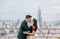 Taipei city skyline viewed from Shangri-La's Far Eastern International Hotel with couple kissing