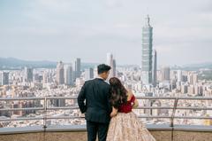Skyline of Taipei viewed from Shangri-La's Far Eastern hotel with Ken and Helen standing seen from behind