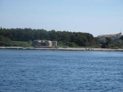 Blockhaus near Bateguier cape with Fort Royal in the background on Sainte-Marguerite island