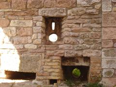 Narrow slit window of Assisi fortress wall