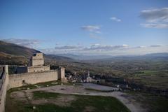 Black and white photo of Assisi Rocca Maggiore fortress on a hill