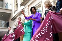 Michelle Obama cutting ribbon at Metropolitan Museum of Art's American Wing opening in 2009