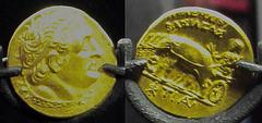 Ancient coin of Ptolemy I riding a quadriga of elephants