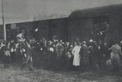 Jews from Warsaw Ghetto boarding trains at Umschlagplatz in German-occupied Warsaw during summer 1942