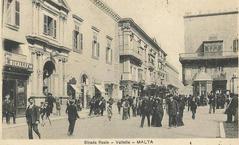 Strada Reale street in Valletta, Malta showing kiosk at corner of St John and Republic street