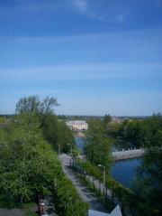Inđijan river flowing through a lush green landscape with hills in the background