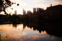 Sunrise over city skyline with modern high-rise buildings