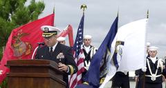 Commander Brian Solo speaking at USS Cole memorial ceremony at Naval Station Norfolk honoring sailors killed in 2000 terrorist attack