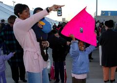 Rashida Smith waiting with her children for her husband Keith Smith aboard USS Cole guided-missile destroyer in Norfolk 2006
