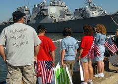 Friends and family waiting on the pier at Naval Station Norfolk for the return of USS Cole guided-missile destroyer