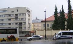 Fragment of Warsaw city with street, buildings and pedestrian crossing
