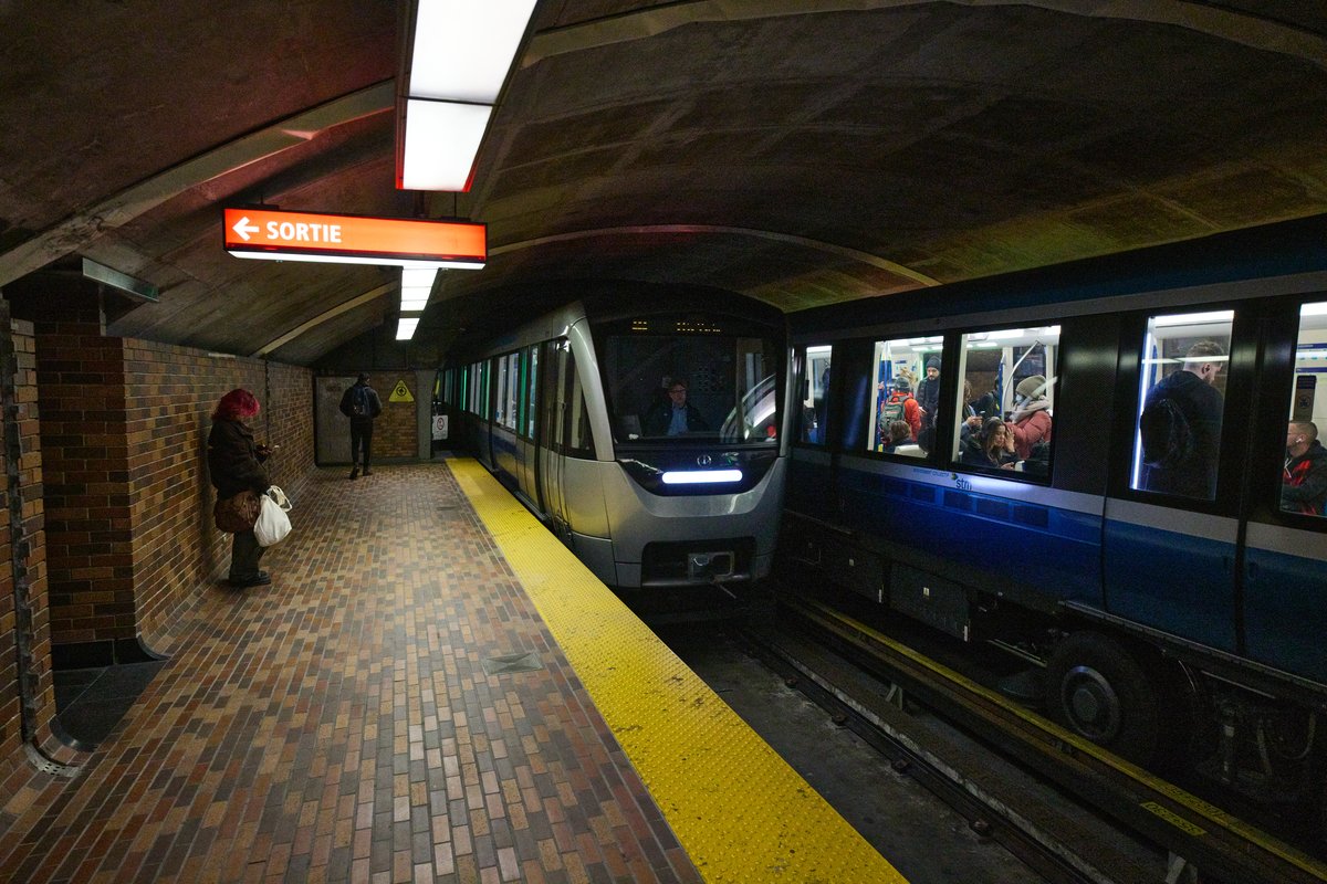 Côte-Vertu-bound Azur metro train passing another Azur train arriving at Mount-Royal station