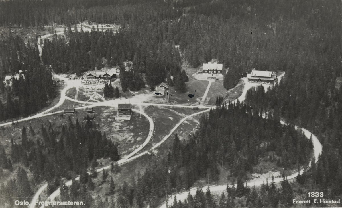 View of Frognerseteren area in Oslo with buildings and forested hills
