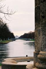 Hubertusbrunnen fountain in Munich with channel view towards Nymphenburg Palace