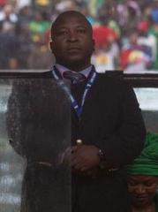 Thamsanqa Jantjie standing next to US President Barack Obama speaking at Nelson Mandela memorial service in Soccer Stadium Soweto