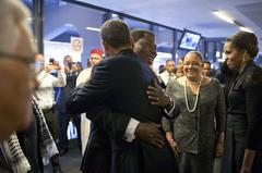 President Yayi Boni of Benin welcoming President Obama at soccer stadium for Nelson Mandela memorial service