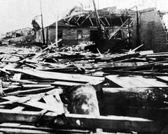 Aftermath of the 1928 Okeechobee Hurricane in West Palm Beach, Florida showing damaged buildings and flooded streets
