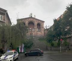 Exterior view of Tumanyan Museum in Yerevan with trees and a clear sky in May 2018