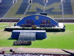 Graduation ceremony at Michigan Stadium with graduates and audience