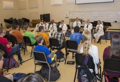 U.S. Fleet Forces Band members The Navigators engaging with band students at Noblesville High School during Indianapolis Navy Week 2015