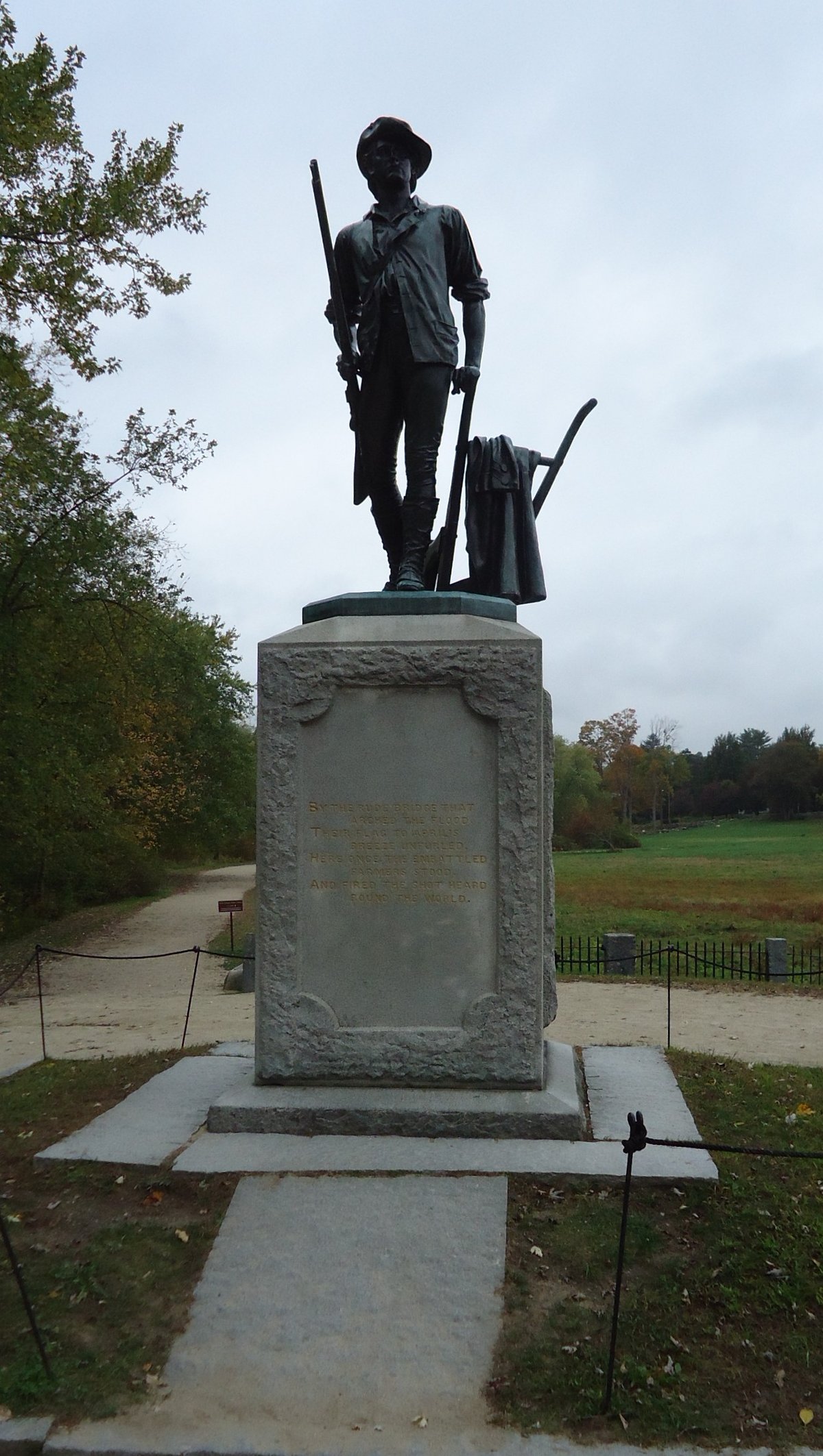 Statue of Minuteman militiaman soldier near historic Concord bridge in Massachusetts