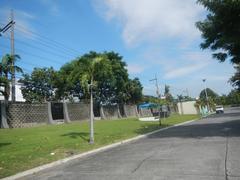 Main chapel and crematory of Manila Memorial Park in Sucat, Parañaque City with landscaped grounds and clear sky