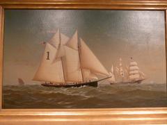 Historic Pilot Boat Thomas Howard sailing near Delaware Bay and River with three-masted bark in background