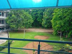 Badminton court set in an open outdoor area under clear sky