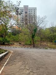 Pathway view of a block in IIT Bombay with modern architecture and greenery