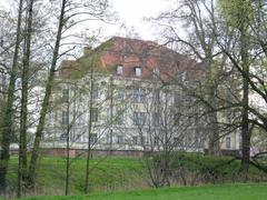 Castle in Leśnica, Wroclaw, Poland surrounded by greenery and clear sky