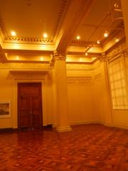 Ground floor of the National Art Gallery at the National Museum of the Philippines featuring paintings El Asasinato del Gobernador Bustamante by Felix Resurrección Hidalgo and Spoliarium by Juan Luna