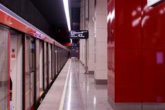 Inside Mnyovniki metro station in Moscow with modern design and passengers