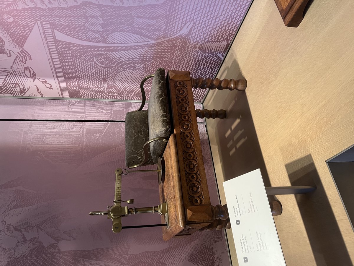 Antique weighing scale Balance displayed at Musée Galilée with intricate metal craftsmanship